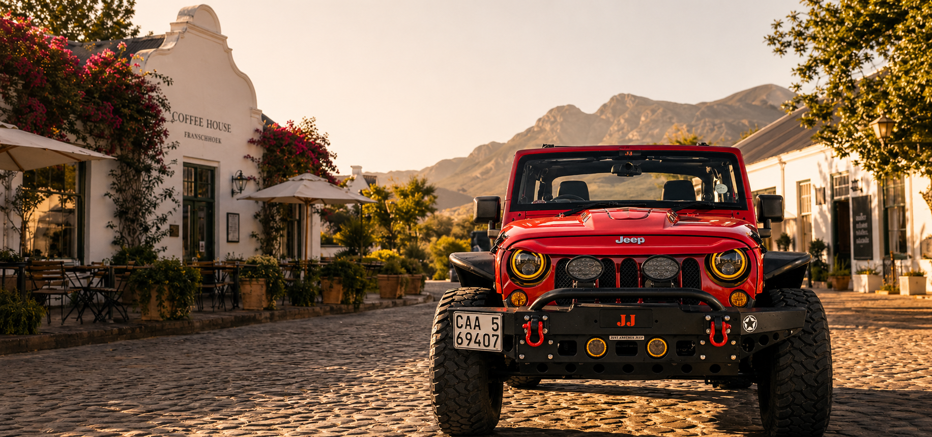 Red Jeep parked at a Cape Town coffee shop